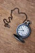 old pocket watch on  wooden background