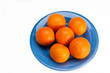 Blue plate with six oranges