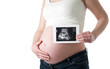 Pregnant woman holding ultrasound picture