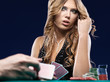 Foto: Woman doubt in a card gambling match Woman doubt in a card gambling match