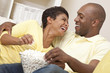 Happy African American Couple Eating Popcorn Watching Movie