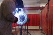 worker weld metal in factory and sparks