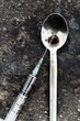 Dirty syringe and spoon