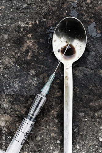 Photo: Dirty syringe and spoon Dirty syringe and spoon
