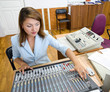 audio operator at audio control console