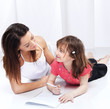 Woman and child drawing on notepad Woman and child drawing on notepad