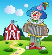 Clown playing accordion near tent