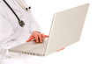 Photo: female doctor with stethoscope holding a laptop female doctor with stethoscope holding a laptop