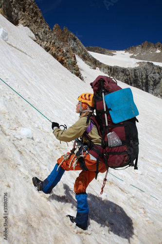 Photo: Mountaineer girl moving down on rope Mountaineer girl moving down on rope
