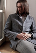 handsome man sit by the window