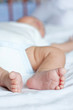 cute little baby is sleeping on the bed