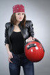 attractive motorcyclist posing with motorcycle equipment