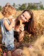 Woman with child in field Woman with child in field