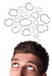 Young man with Speech Bubbles over his head