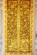 Thai style carving on temple door Thai style carving on temple door