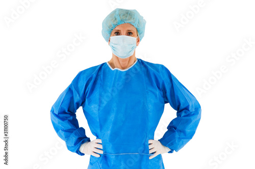 Photo: "female surgeon standing with coat "female surgeon standing with coat