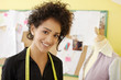 Woman working with sketches in fashion design studio