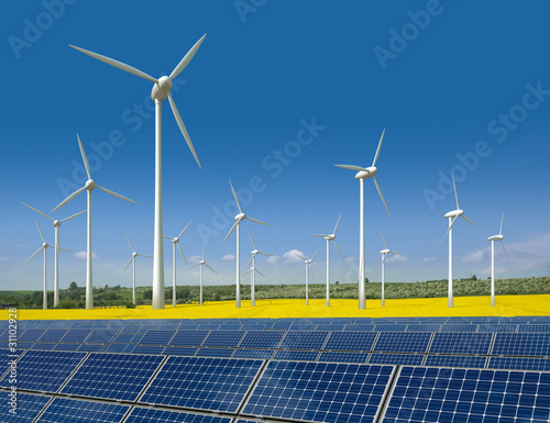 Photo: Windkrafträder und Solarmodule in einem Rapsfeld Windkrafträder und Solarmodule in einem Rapsfeld