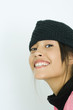 Teen girl wearing knit hat, portrait