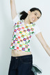 Teen girl jumping into the air