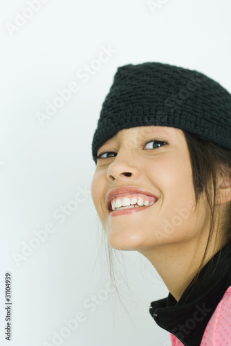 Photo: Teen girl wearing knit hat, portrait Teen girl wearing knit hat, portrait