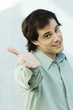 Man holding out hand to camera, portrait