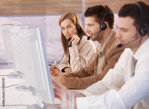 Photo: Attractive female customer servicer working Attractive female customer servicer working