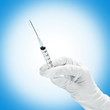 Syringe with medicine in hand
