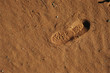 Shoeprint in sand, high angle view, close-up