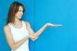 Woman with arm extended, one hand under elbow