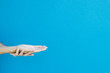 Woman holding out hands, cropped view, close-up