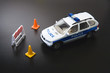 Toy police car and traffic cones, close-up