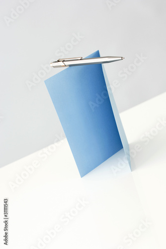 Photo: Blank greeting card and pen, close-up Blank greeting card and pen, close-up