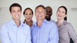 Happy business team standing together and smiling