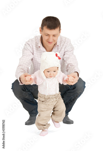 Photo: baby making first steps with father help baby making first steps with father help