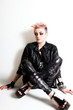Young Female Punk Sitting Against a Wall Young Female Punk Sitting Against a Wall