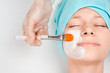 Woman at spa procedures applying mask Woman at spa procedures applying mask