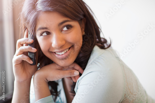 Photo: Asian student on the phone Asian student on the phone