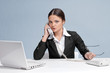 Casual business woman in office talking by phone