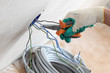 worker puts the wires