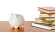 Piggy bank and books