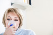 Woman Using A Nebulizer