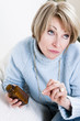 Pensive Woman Taking Pills