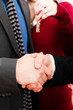 Couple receiving keys from real estate broker Couple receiving keys from real estate broker