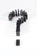Row of black dominoes forming a question mark