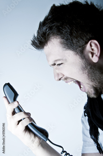 Photo: Man shouting on the phone Man shouting on the phone