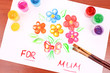 Opened paint buckets colors and drawing flowers Opened paint buckets colors and drawing flowers