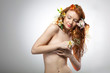 Photo: Portrait of beautiful naked woman with spring flowers Portrait of beautiful naked woman with spring flowers