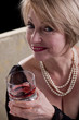 Happy Mature Woman With Drink