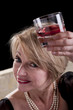 Happy Mature Woman With Drink